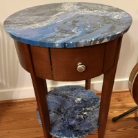 Round end table with shelf and resin top
